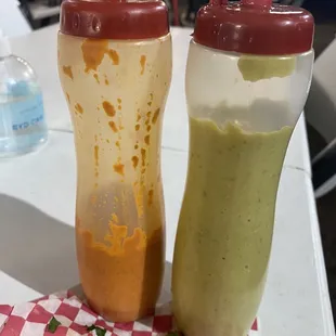 The 2 sauces served with the 5 Taco plate.  Orange is habanero heat  The other is an excellent Crema with mild heat.