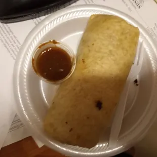 Burrito and spicy salsa. Theres no cheese or sour cream inside as it's authentic Mexican. Yummy.