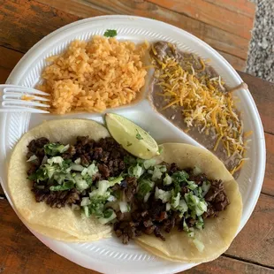 2 beef tacos with beans &amp; rice.