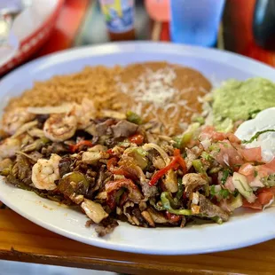 Mixed fajita with corn tortillas on side