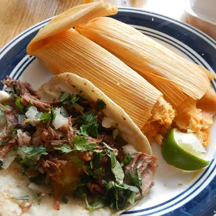 Carnitas taco and a couple of pork tamales (takeout.) Yummay.