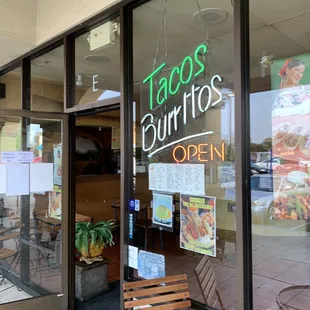 a taco's burritos open sign