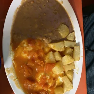 Huevos rancheros, potatoes &amp; refried beans