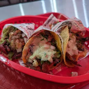 2 Al Pastor (middle and right) and 1 carne asada quesataco (left)