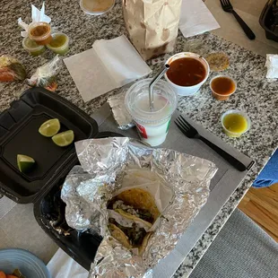 Steak taco dinner , both kinds of salsa . An order of salsa and chips . Rice water small.