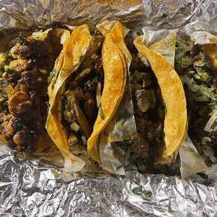 three tacos on tin foil