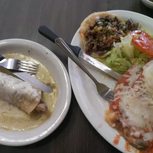 Carnitas enchilada, tacos de carne asada and chili relleno made with Chile poblano.