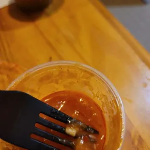 Piece of rice that doesn't belong to red salsa.