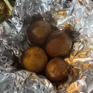 Sauced potatoes that come with mini tacos.... SO GOOD