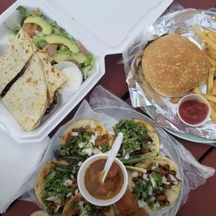 a plate of food and a container of fries