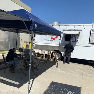 a taqueria truck parked in a parking lot