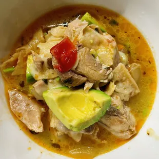 Chicken Tortilla Soup (takeout) - loaded with giant chunks of chicken, avocado, tortilla, cheese, and deliciousness.
