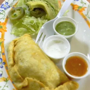 Empanada, tasty with the added toppings.