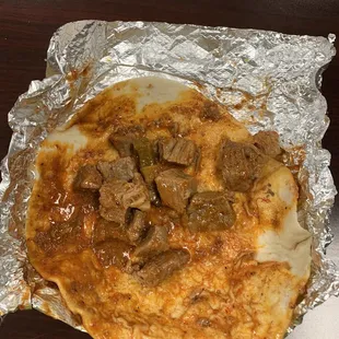 a taqueria with meat and cheese