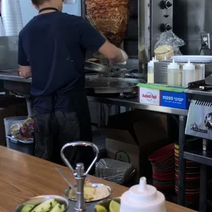 Carving al pastor for my tacos.
