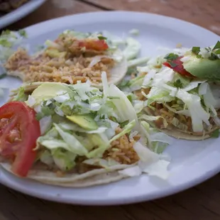 Two regular tacos and one half eaten regular taco from the vegan menu! So delicious!