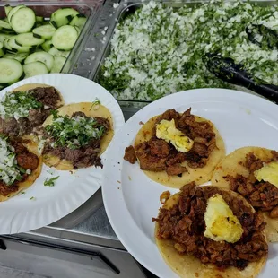 The tacos on the right are Al pastor with pineapple on top..  so good.