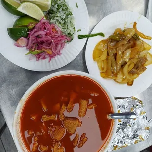 a bowl of soup and a plate of vegetables