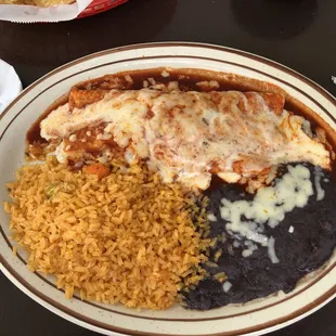 Enchiladas, rice and black beans.