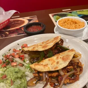 Grilled Chicken Quesadilla with a side of rice.
