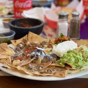 These nachos supreme with picadillo beef will take you to another realm. SO good. YUM!