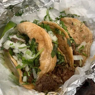 Steak tacos with cilantro and onion
