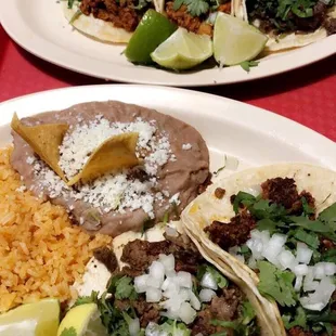 Beef and chorizo taco platter , 3 taco of pork beef head and tongue .