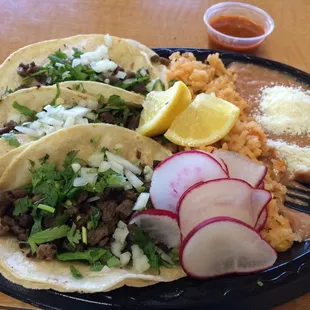 Steak tacos, rice, beans