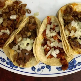 #1 Four tacos no cilantro; from left to right - tripa, lengua, pastor, y cabeza.  Cabeza and tripa were my favorite.