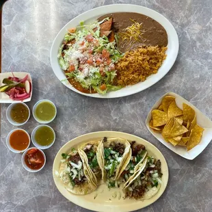 Enchiladas rancheras ($11.99 USD) and tacos ($2.50 USD each)