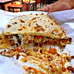 Half eaten quesadilla. Small size..still huge!!