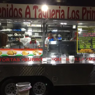 a woman ordering food from a food truck