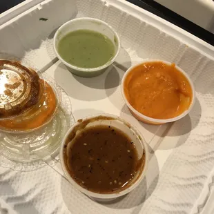 3 sauces. The orange one is Habanero and super spicy. Used with caution.
