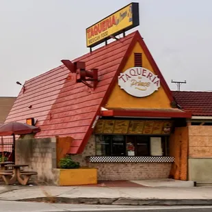 a taqueria with a red roof