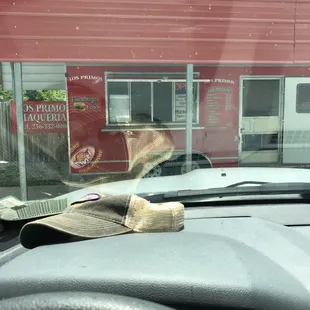 a hat on the dashboard of a car