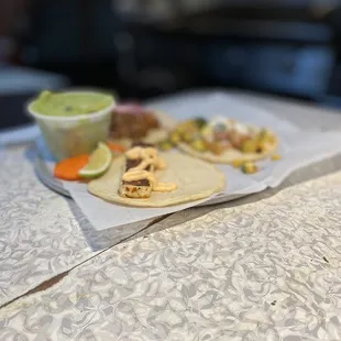 a taco and a bowl of guacamole