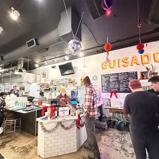 Order counter and kitchen view from the front right entrance.