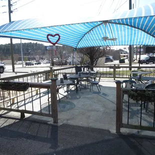 Covered patio seating next to Clairmont Road.