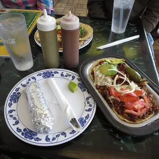 Al Pastor (pork and steak) special. Sauteed with bacon, onions, and cheese, topped with tomatoes, avocado, jalapeno. Tortillas.