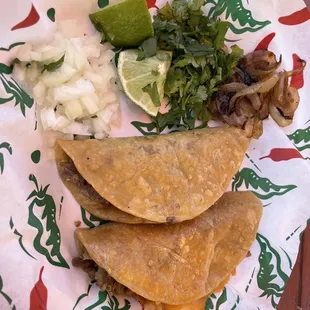 Sirloin tacos. Shells are on the crispy side with melted cheese.
