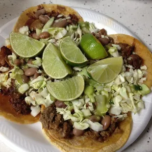 Four tacos consisting of Pork, steak and meat stew (Birria).