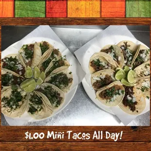 two plates of tacos on a table