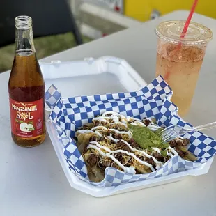 Asada fries with Agua mineral preparada