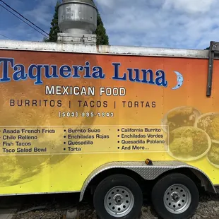 a food truck parked on the side of the road