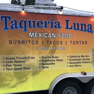 a food truck parked on the side of the road