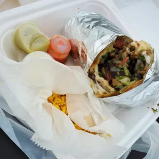 DELICIOUS and GIANT steak burrito with rice on the side