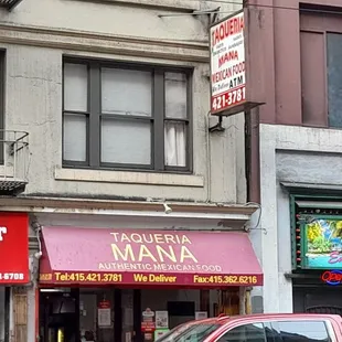 a red truck parked in front of a restaurant