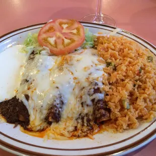 Enchiladas (shredded beef and chicken) with mole sauce. Both very cheesy, hot and delicious.