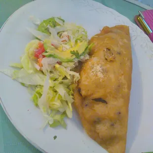 a plate of food and a salad