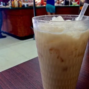 Horchata with the buffet area behind.